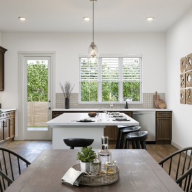 Kitchen and dining area with a view of the backyard