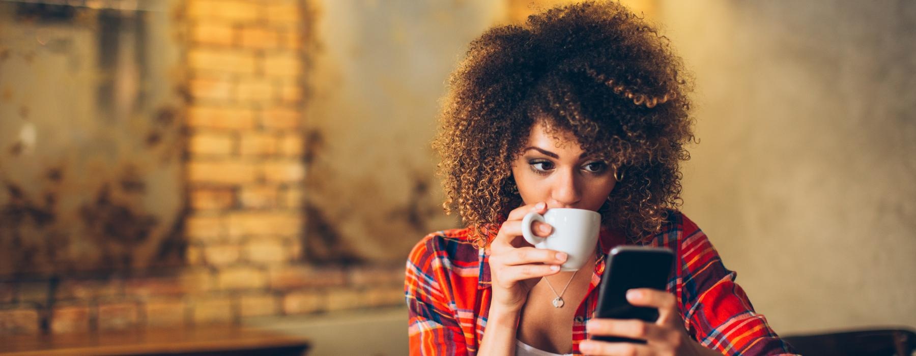 a person drinking from a cup