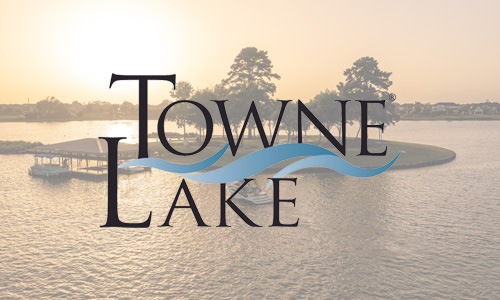 Towne Lake logo and view of trees on an island in the middle of a lake